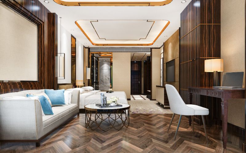 Aesthetically pleasing living room with wooden paneling and a large TV, exemplifying home interior design.